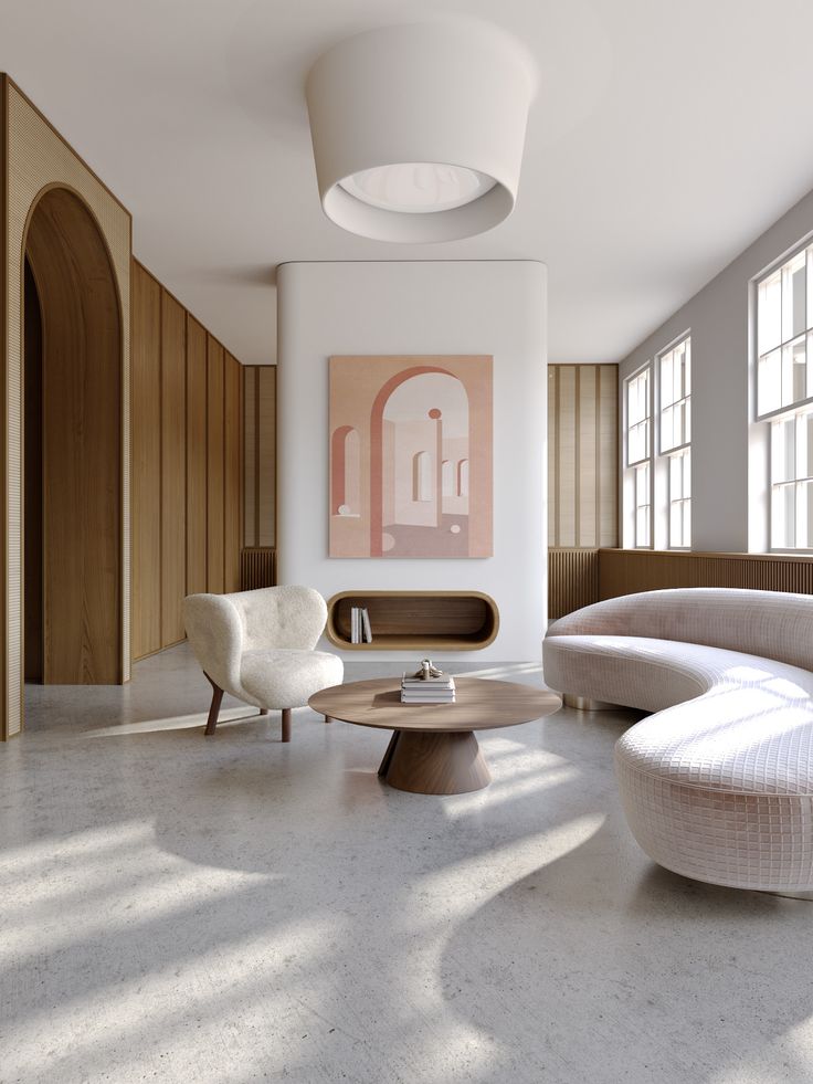 a living room filled with white furniture and large windows next to a wooden paneled wall