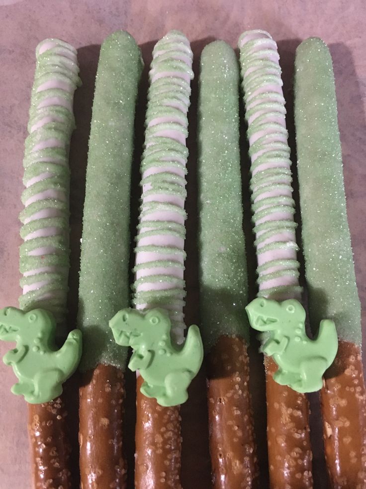 several green and white desserts are lined up