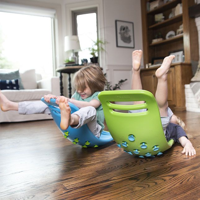 two children playing with toys on the floor