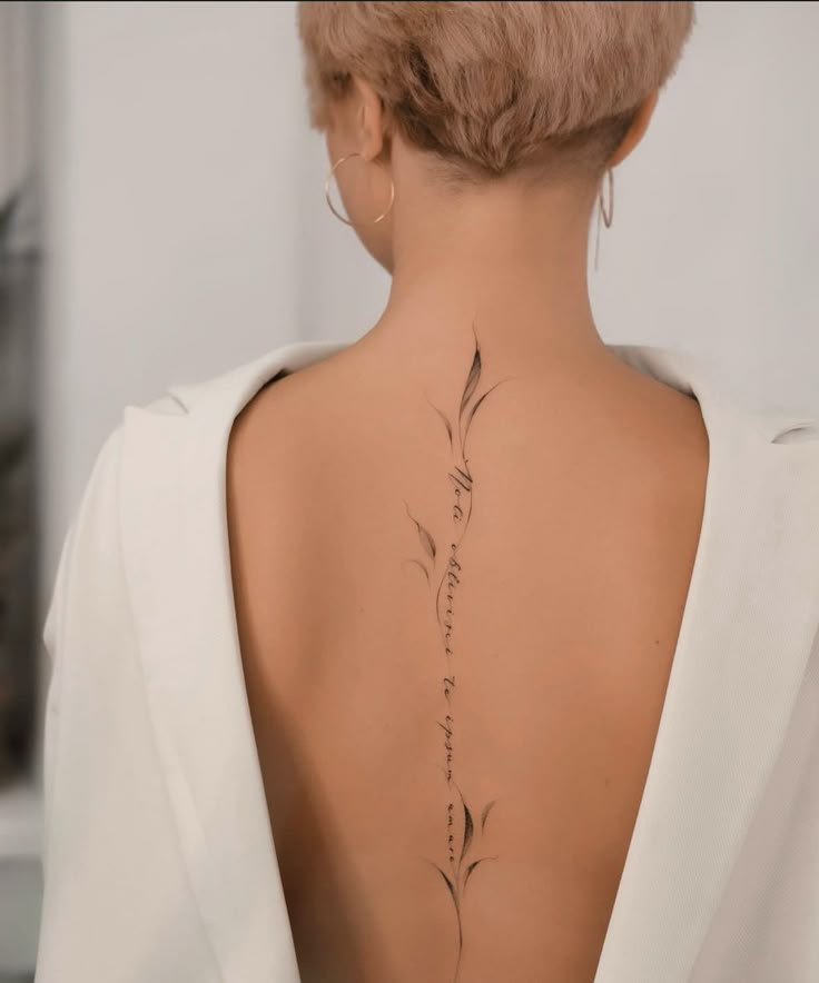 the back of a woman's neck is shown with an inscription written in cursive writing