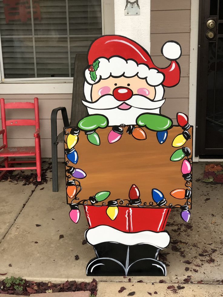 a santa clause sign on the side of a house