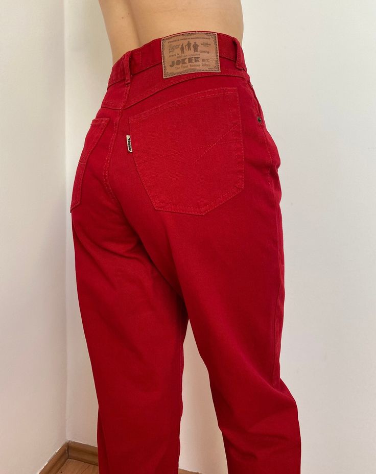 Vintage high-waisted red mom jeans.  These jeans feature a flattering tapered leg cut and a bold red hue, perfect for standing out. The high-waist design adds a touch of retro charm while ensuring a comfortable fit. Embrace your individuality with this unique and stylish piece that remains true to its vintage origins. Size: Small. Measurements: Waist: 33cm, 13" Rise: 29cm, 11,4" Hip: 52cm, 20,4" Inseam: 75cm, 29,5" Material: 100% cotton. For best fit, please compare measurements to an item you a Style Mom Jeans, Vintage Mom Jeans, Vintage Mom, Jean Vintage, Red Jeans, Jeans Mom, Vintage Leather Jacket, Red High, Womens Jeans