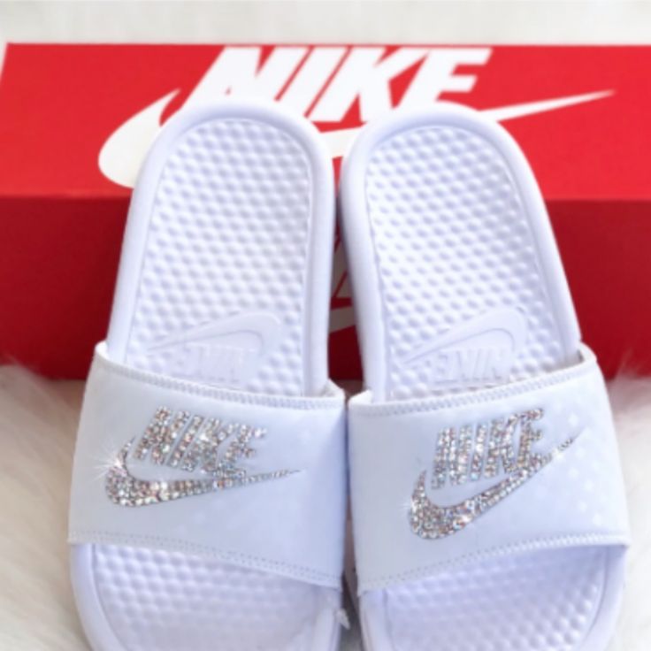 Women's Bling Nike Slides. Each Shoe Is Hand Designed With Crystals Being Placed One By One, Making This A Time Consuming Process But The End Result Is Truly An Amazing Work Of Art. Made To Order. Please Allow 2 Weeks To Ship. Dm After Purchasing To Discuss Bling Color Change If Needed, Be Sure To Check My Other Bling Shoe Listings For Different Gem Colors & Designs. Custom Orders Are Welcome. Please Notify Me First If You Need Your Order By A Certain Date. There Is A Rush Order Fee. Nike White Low-top Sandals, White Nike Low-top Sandals, Nike Sliders, Nike Benassi Slides, Nike Slippers, Nike Footwear, Nike Sandals, Nike Benassi, Nike Slides