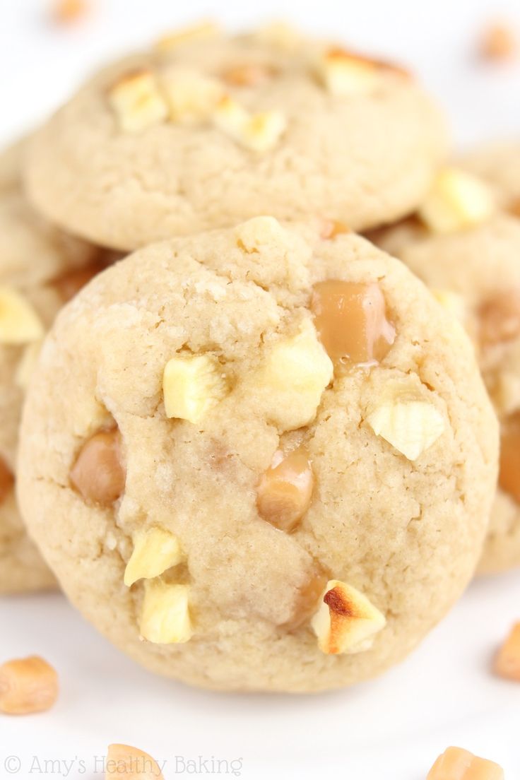 three cookies stacked on top of each other with nuts in the middle and one cookie missing