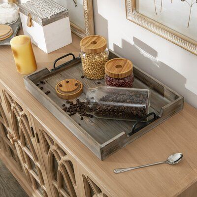 a tray with some food on top of it next to a candle and other items