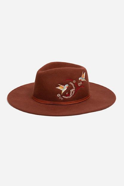 Crafted from 100% wool, the Hummingbird Heather Hat is available in an earthy rust color. Featuring a mid-height crown and a wide brim, this hat is finished with intricate placement embroidery and a decorative feather placed thoughtfully at the hatband. Style with a denim-on-denim look and western style boots for an eclectic ensemble. Johnny Was Women's Hummingbird Feather Hat in Rust Brown, Denim Bohemian Brown Wool Hat, Bohemian Wool Hat For Fall, Brown Felt Hat With Curved Brim For Fall, Brown Fedora For Rodeo In Fall, Brown Felt Hat With Flat Crown For Fall, Brown Wide Brim Felt Hat For Fall, Bohemian Wool Felt Hat For Fall, Brown Felt Hat For Fall Rodeo, Brown Felt Hat For Rodeo In Fall