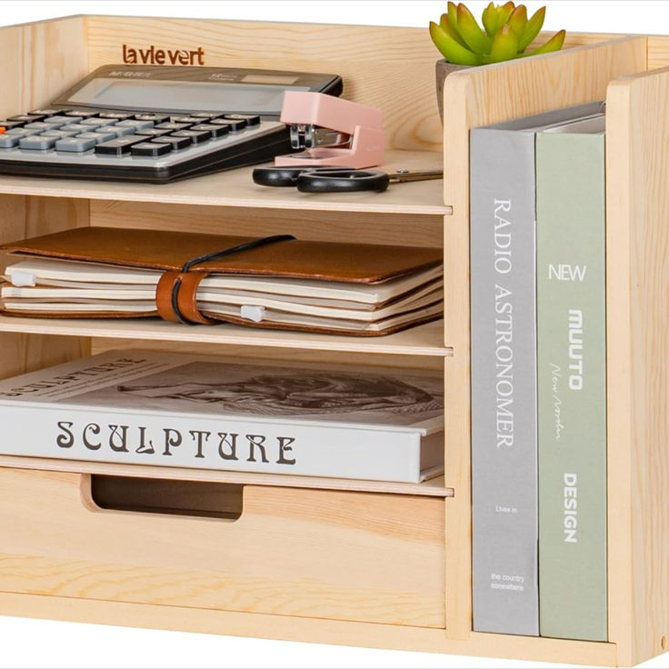 a book shelf with books and a calculator on it's bottom shelf