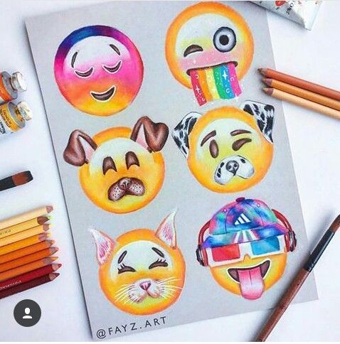 an assortment of emotication stickers with colored pencils