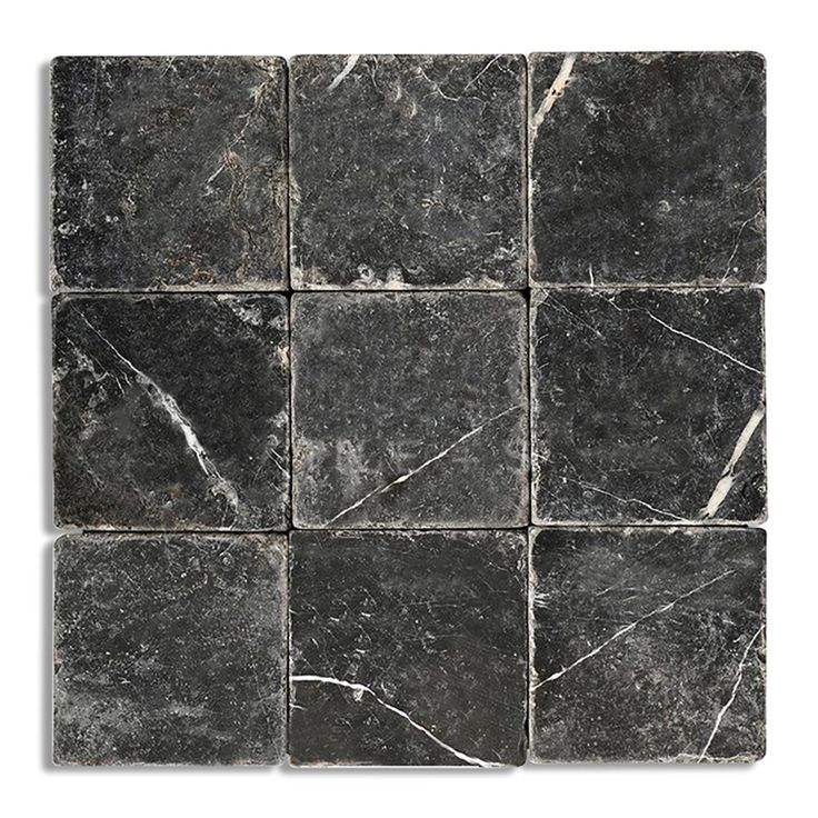 black marble tiles with white veining on the edges and one square in the middle