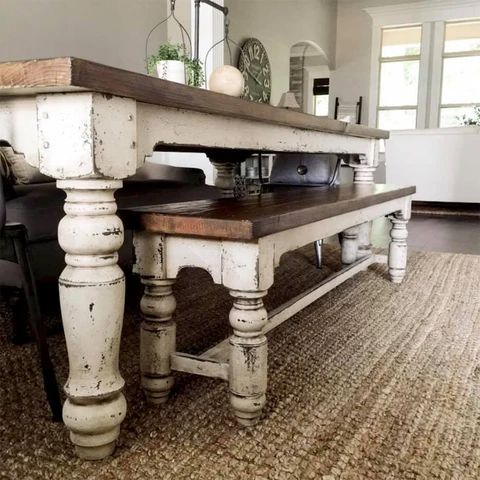 an old table is sitting in the middle of a room