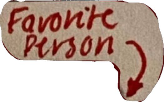 a sign that says favorite prison painted on the side of a white wall with red writing