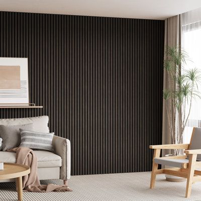 a living room filled with furniture next to a wall covered in black and white stripes