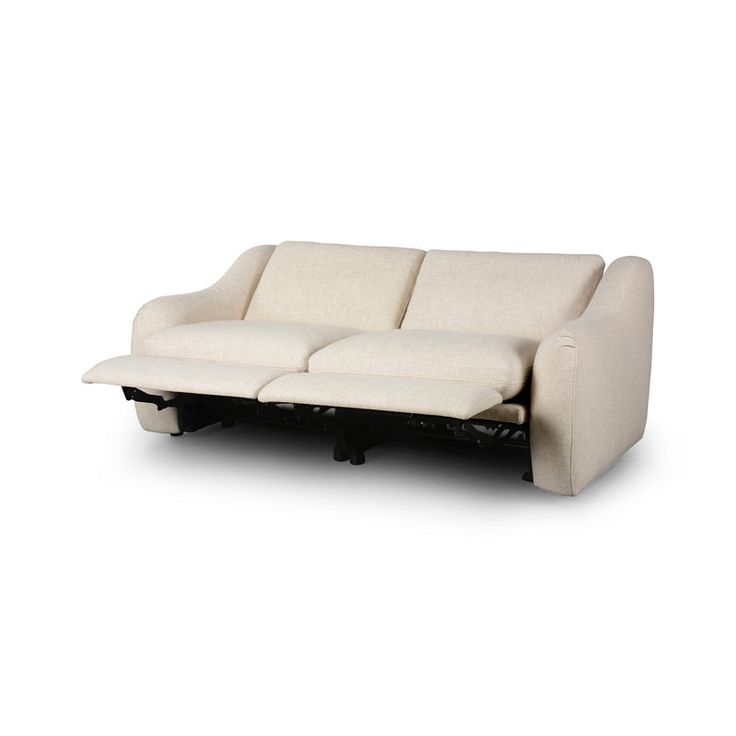 a white couch sitting on top of a wooden table