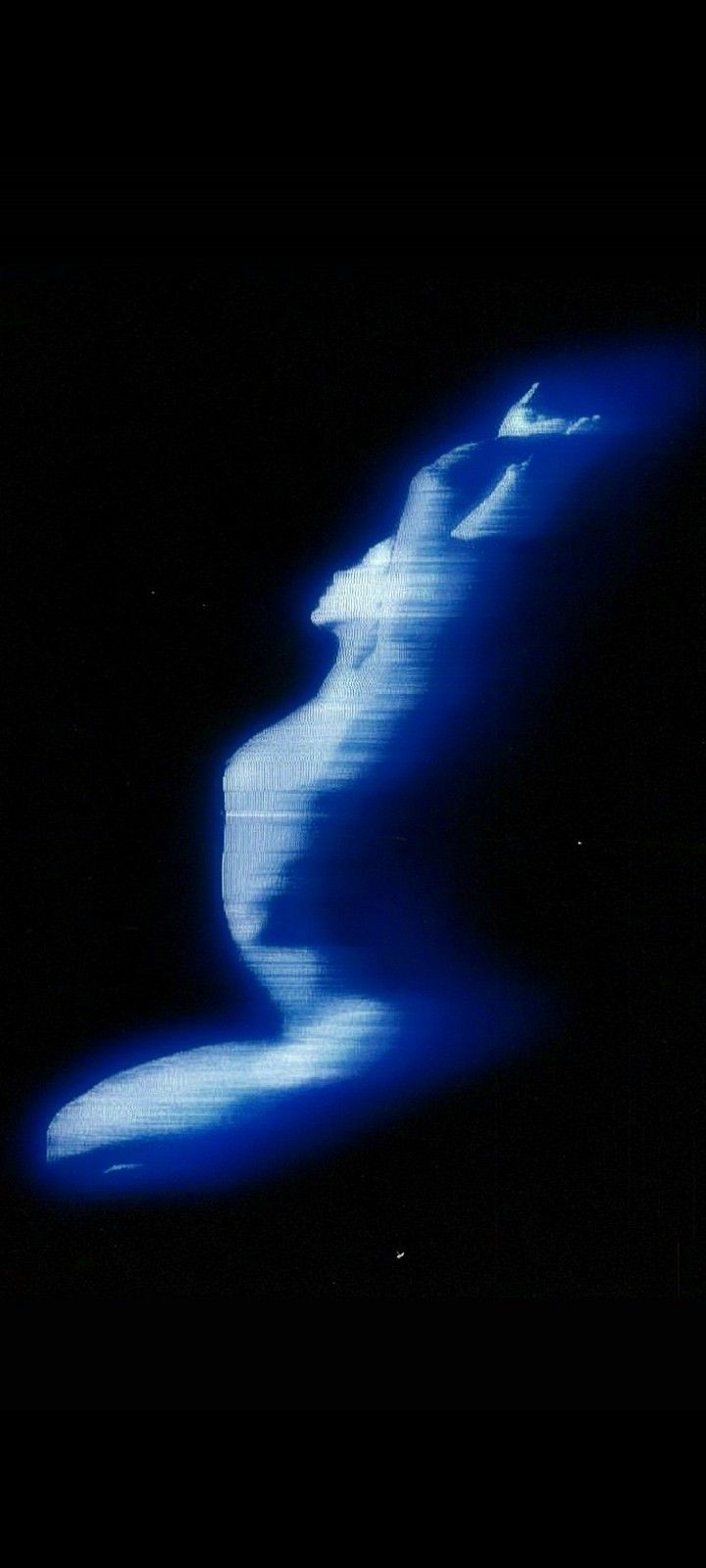 an abstract image of blue waves in the dark