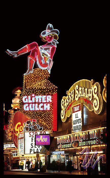 the neon signs are all lit up at night in las vegas, n y c