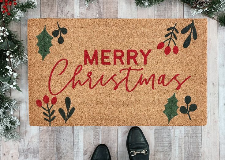 Deck your doorstep with this festive Merry Christmas Coir Doormat! Handmade and ready to bring festive cheer to any porch, this holiday doormat features script Merry Christmas text in red and holiday greenery and comes in three sizes perfect for any entryway Diy Rug Painting, Holiday Doormat, Door Mat Diy, Fall Doormat, Merry Christmas Text, Holiday Greenery, Halloween Door Mat, Christmas Text, Christmas Doormat