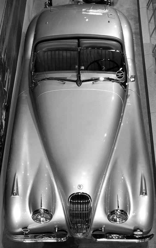 an old car is parked in a garage