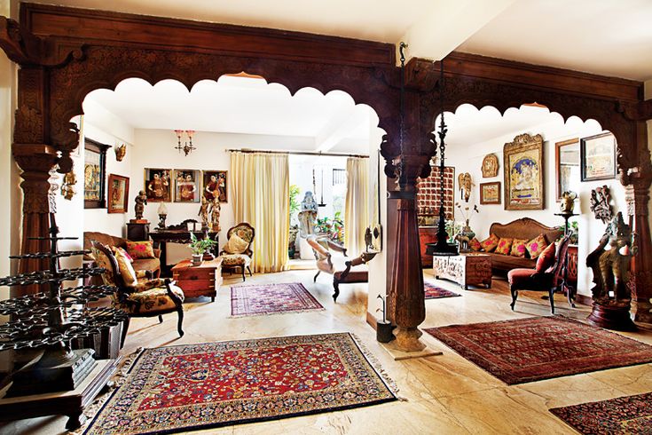 a living room filled with lots of furniture and rugs