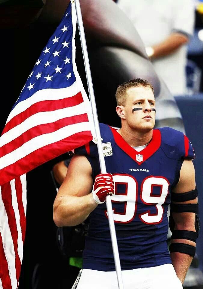 a football player holding an american flag with the words god bless america in front of him