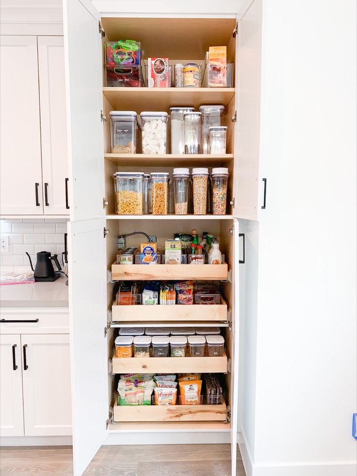 an organized pantry with lots of food in it