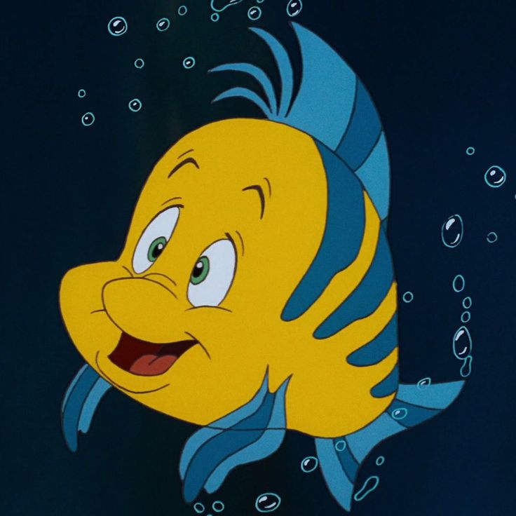 a yellow fish with blue and white stripes on it's face is swimming in the water