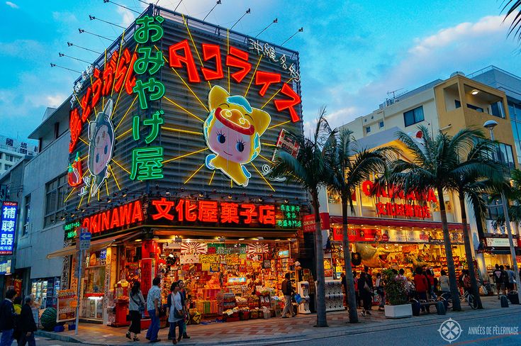 A neon lit gift store on the famous Kokusai Dori shopping street in Naha, Okinawa, Japan Okinawa Aesthetic, Japan Beach, Miyakojima, American Village, Luck Symbol, Japanese Shrine, Japan Picture, Japan Map, Japan Holidays