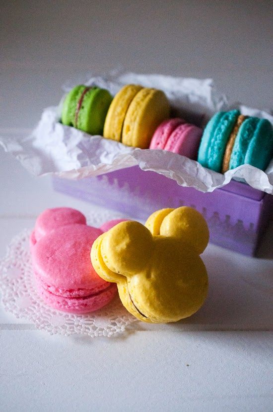 some colorful macaroons are on a doily