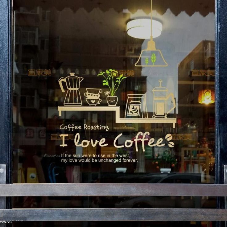 there is a sign in the window that says i love coffee