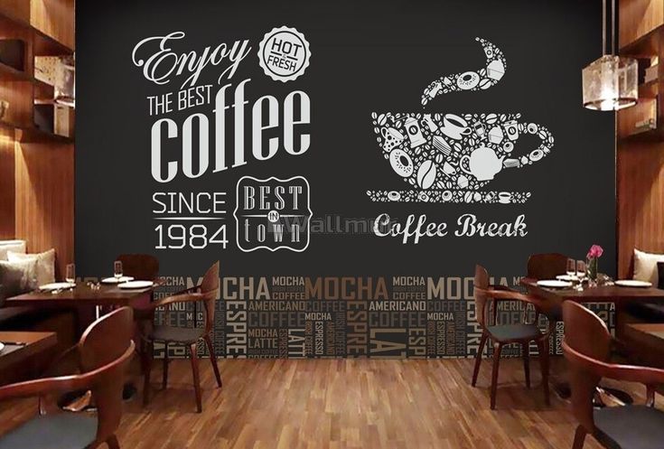 the coffee shop is decorated with black and white wallpaper, which has an image of a cup of coffee on it