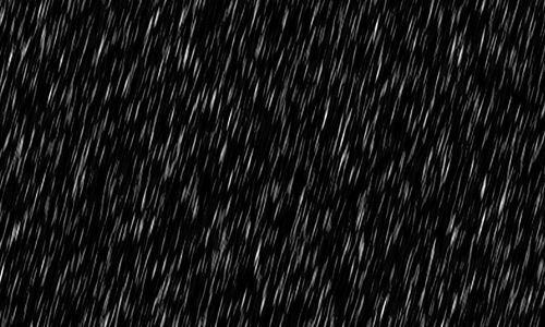 black and white photograph of rain falling down