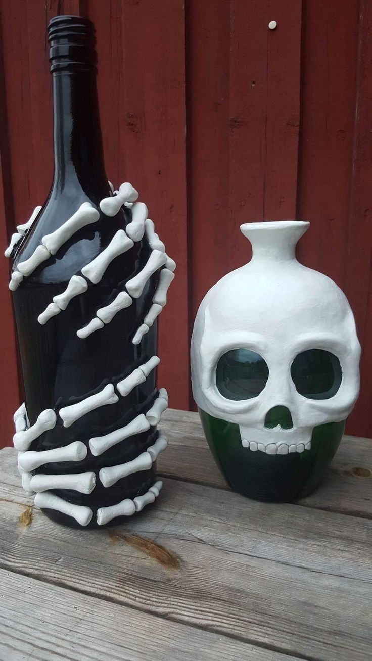 two vases made to look like skeleton bones