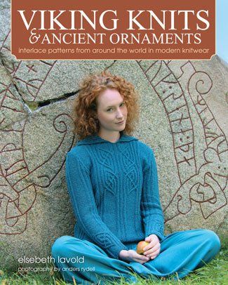 a woman sitting on the ground in front of a stone wall with an inscription viking knits and ancient ornaments