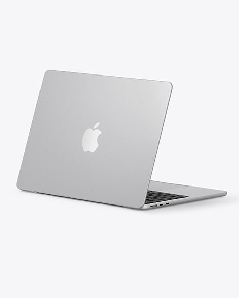 an apple laptop computer sitting on top of a white surface