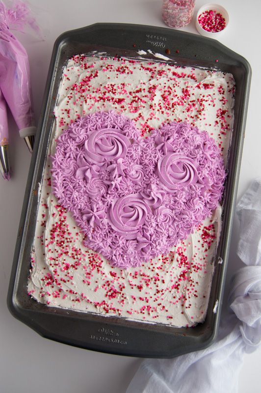 a heart shaped cake sitting on top of a pan