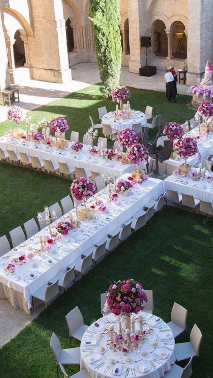 tables and chairs are set up on the lawn