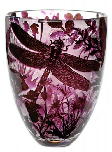 a glass vase with dragonflies and flowers on it