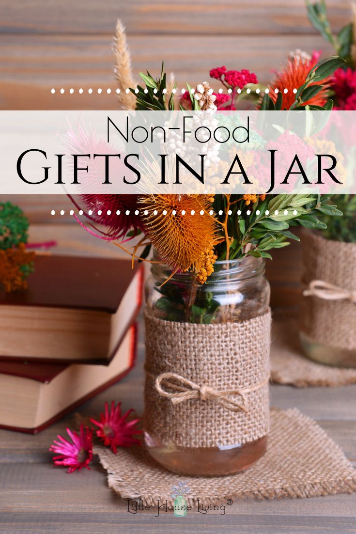 two mason jars with flowers in them and the words, not food gifts in a jar