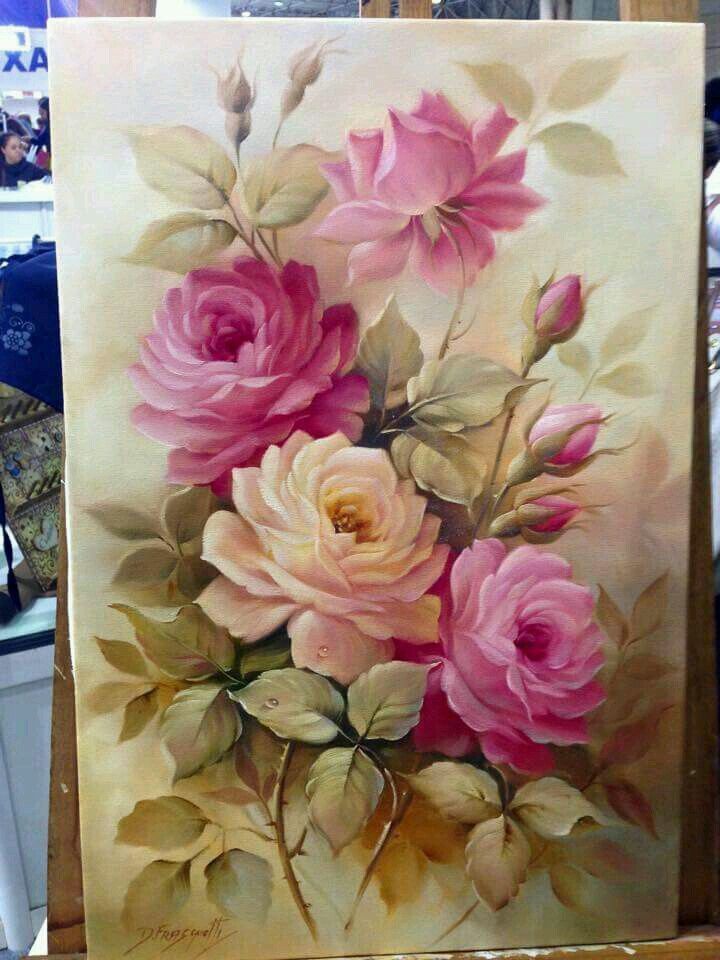 an easel with a painting of pink roses on it