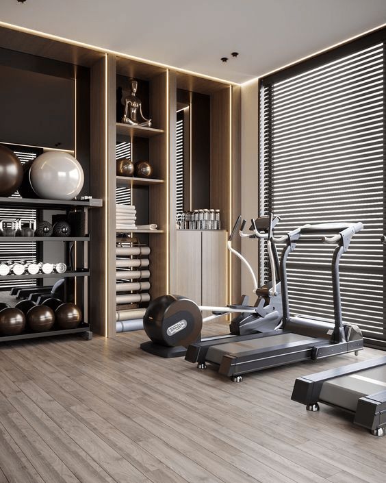 there is a gym with treadmills, exercise equipment and other items in the room