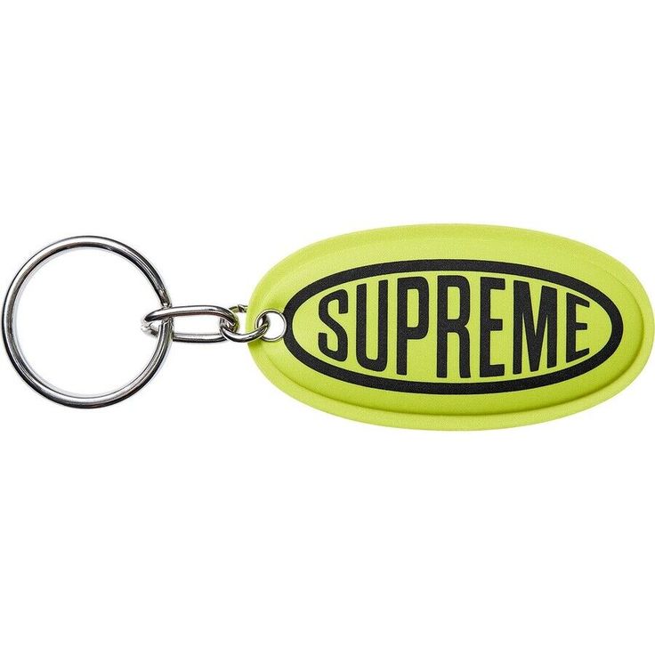 a yellow keychain with the word supreme on it