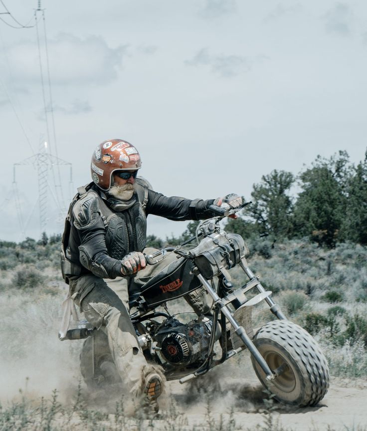 a man riding on the back of a dirt bike