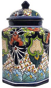 an ornately decorated jar is shown on a white background