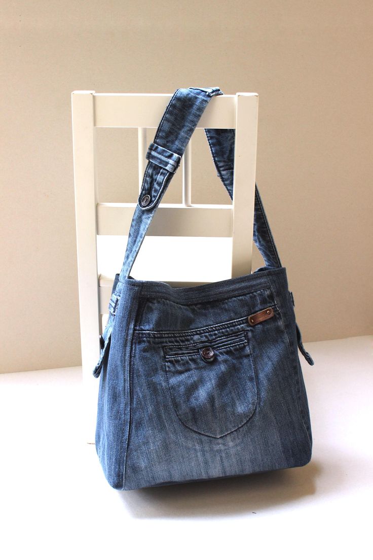 a denim purse sitting on top of a wooden chair next to a white chair with the words sewing pattern written below it