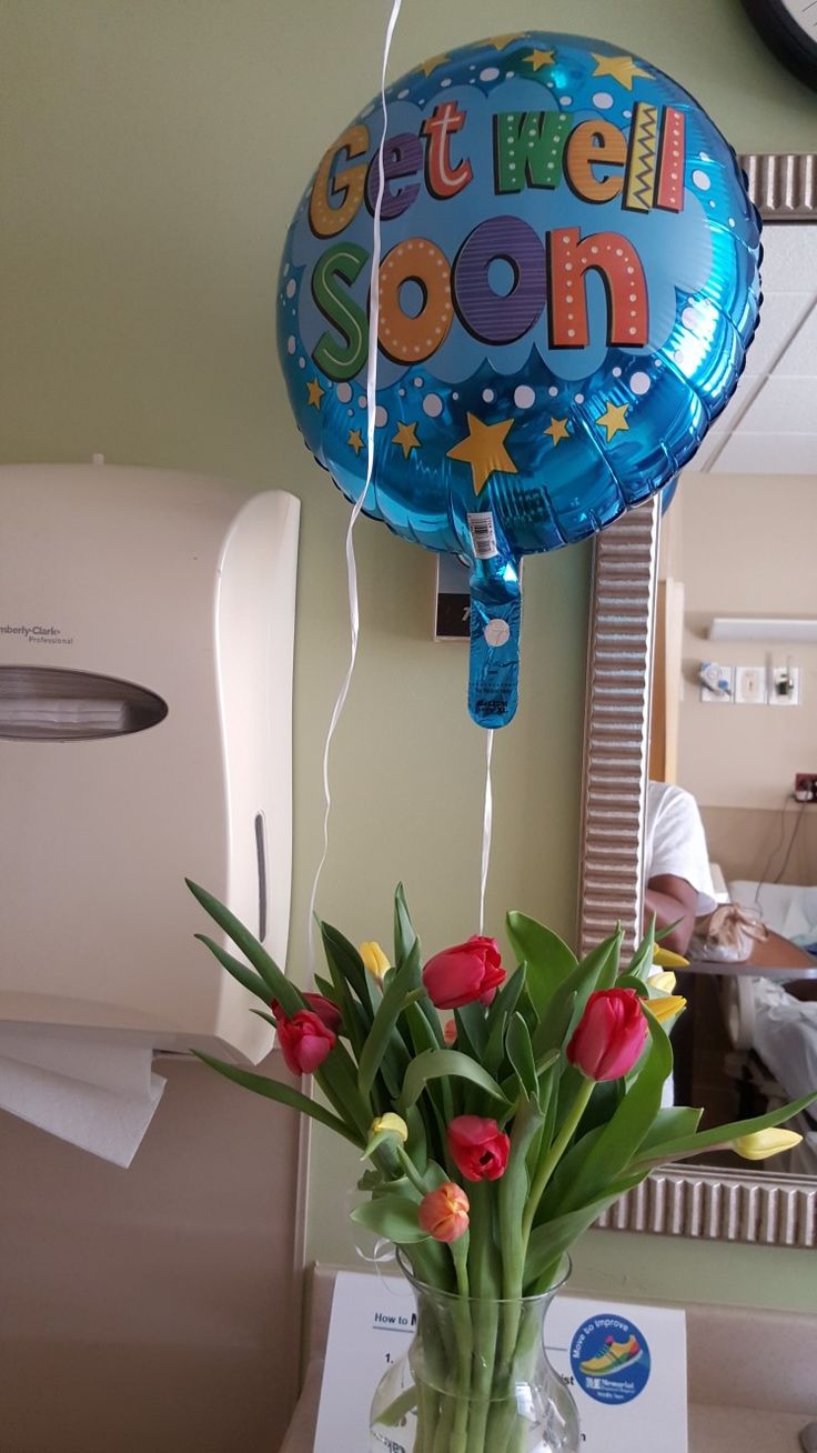 a vase filled with flowers sitting on top of a table