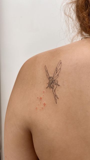 a woman with a tattoo on her back