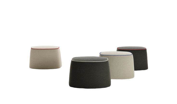 four different colored stools sitting next to each other