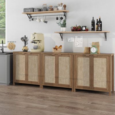 a kitchen with wooden cabinets and shelves filled with food