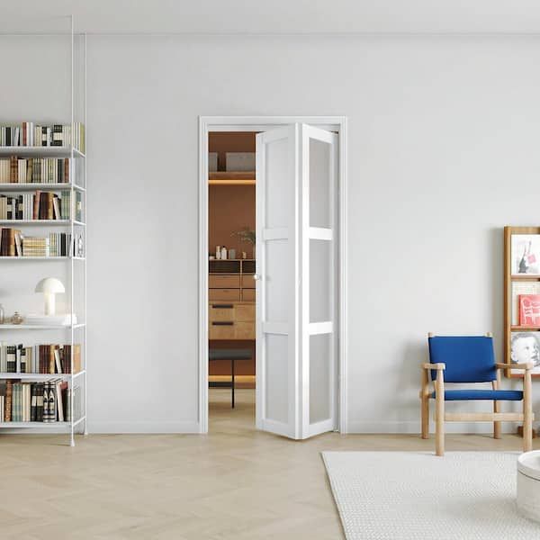 a living room filled with furniture and bookshelves next to a white wall covered in shelves