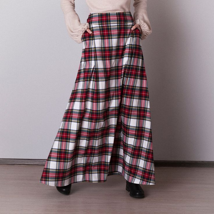 White plaid skirt: - Side seam pockets - Hidden zipper on the back - Lined belted part - Classic tartan pattern - Fabric is 40% wool, 58% polyviscose, 2% of elastane Model is 6'2'', she wears US 8 size US 0  Bust 82 cm (32.5 inches) Waist 64 cm (25 inches) Hips 89 cm (35 inches) US 2  Bust 85 cm (33.5 inches) Waist 66 cm (26 inches) Hips 92 cm (36 inches) US 4  Bust 88 cm (34.5 inches) Waist 68 cm (27 inches) Hips 94 cm (37 inches)  US 6  Bust 90 cm (35.5 inches) Waist 71 cm (28 inches) Hips 96 cm (38 inches)  US 8  Bust 93 cm (36.5 inches) Waist 74 cm (29 inches) Hips 99 cm (39 inches) US 10  Bust 95 cm (37.5 inches) Waist 76 cm (30 inches) Hips 102 cm (40 inches) US 12  Bust 99 cm (39 inches) Waist 80 cm (31.5 inches) Hips 105 cm (41.5 inches) US 14  Bust 103 cm (40.5 inches) Waist 84 cm Plaid Lined Skirt For Winter, Plaid Skirt With Pockets For Winter, Plaid Full Skirt With Lining, Scottish Plaid Skirt For Fall, Scottish Plaid Skirt For Winter, Scottish Style Plaid Skirt For Fall, Winter Scottish Plaid Skirt, Fall Scottish Plaid Skirt, Plaid Skirt With Pockets