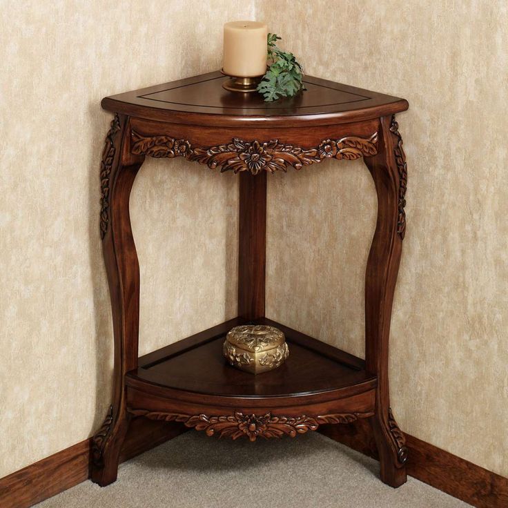 a wooden corner table with a candle on top